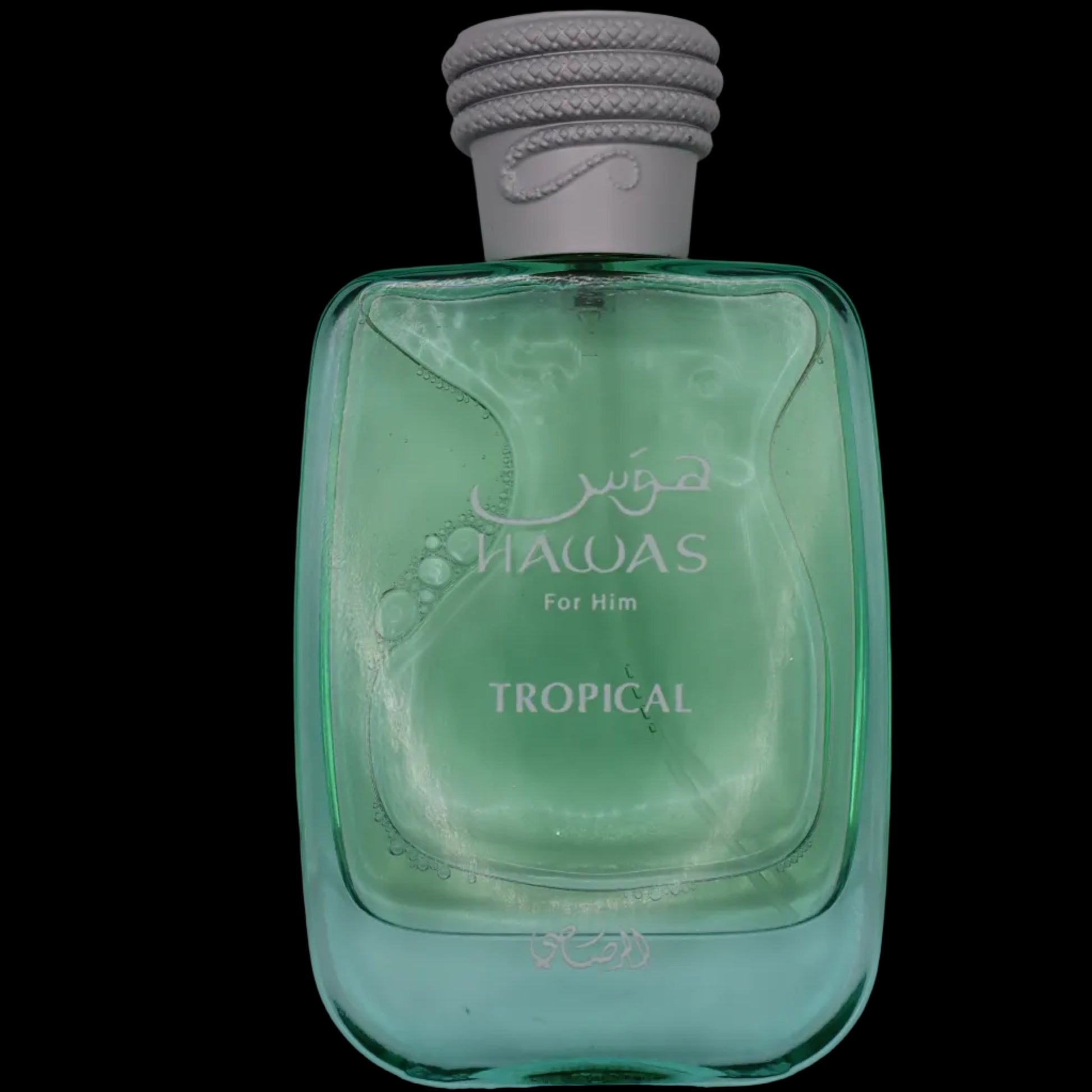 A bottle of HAWAS For Him Tropical cologne, featuring a translucent light green glass bottle and a textured gray cap, set against a plain light gray background.