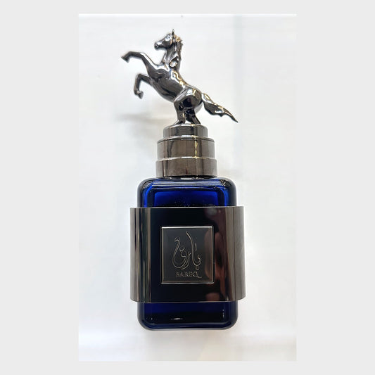 Ard Al Zaafaran Bareq Mirage bottle in blue glass with a rearing horse cap, photographed at the Sheikh Scents shop