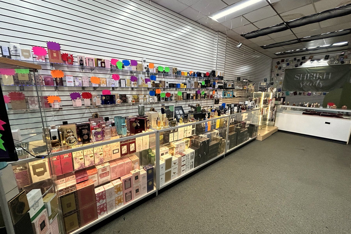 Glass display cases and the fragrance wall inside the Sheikh Scents store in Baltimore